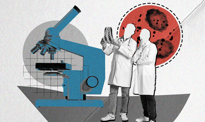 Two researchers standing next to a microscope representing new research on the AI fluency gap and workforce retention.