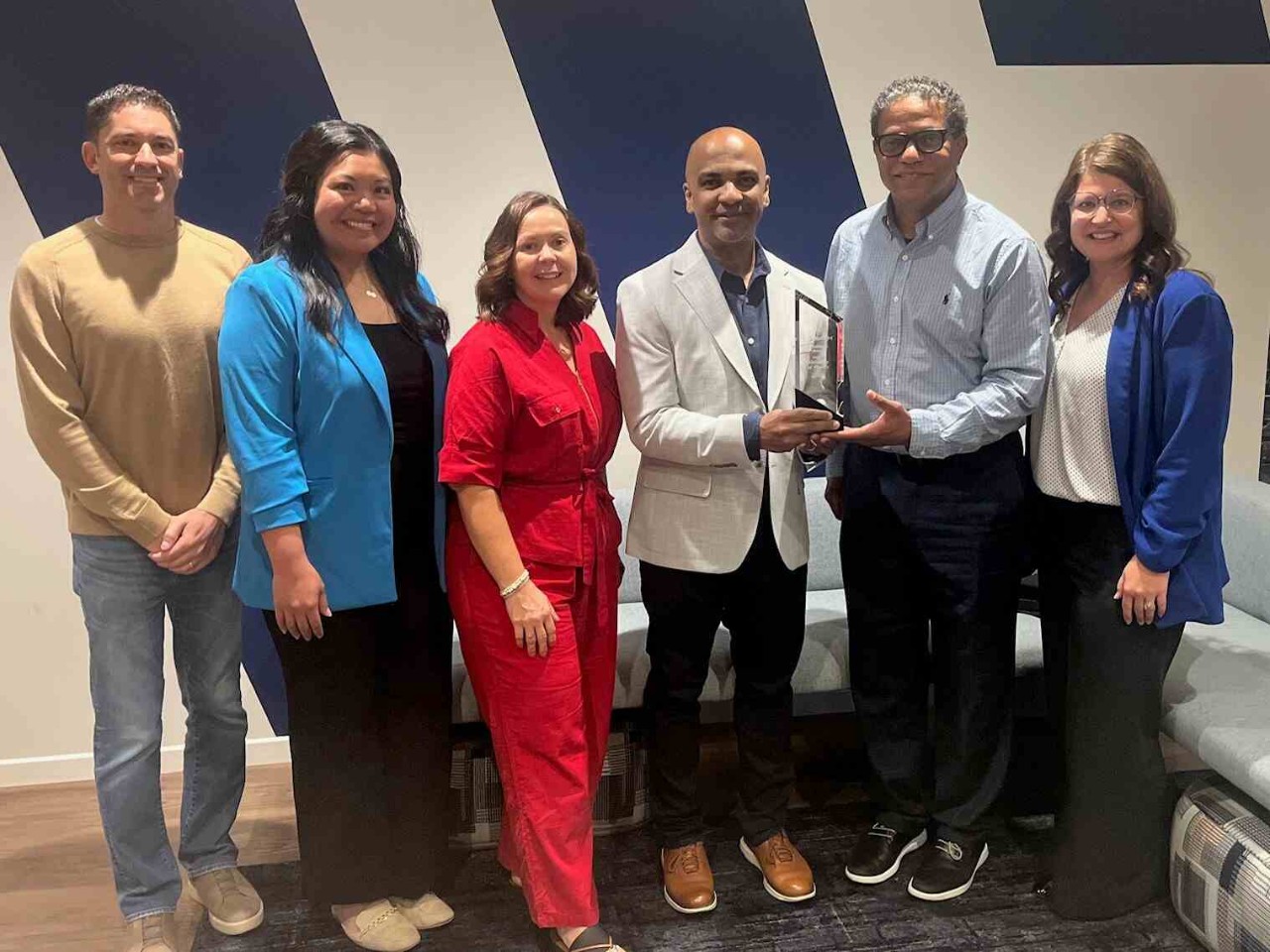 Shown is the Wabash platinum supplier recognition photo with Wabash leadership and UOPX Vice President and General Manager for Workforce Solutions, Jay Titus.