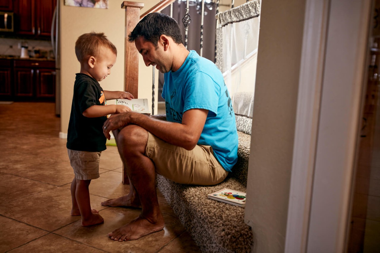 A military service member home with their child