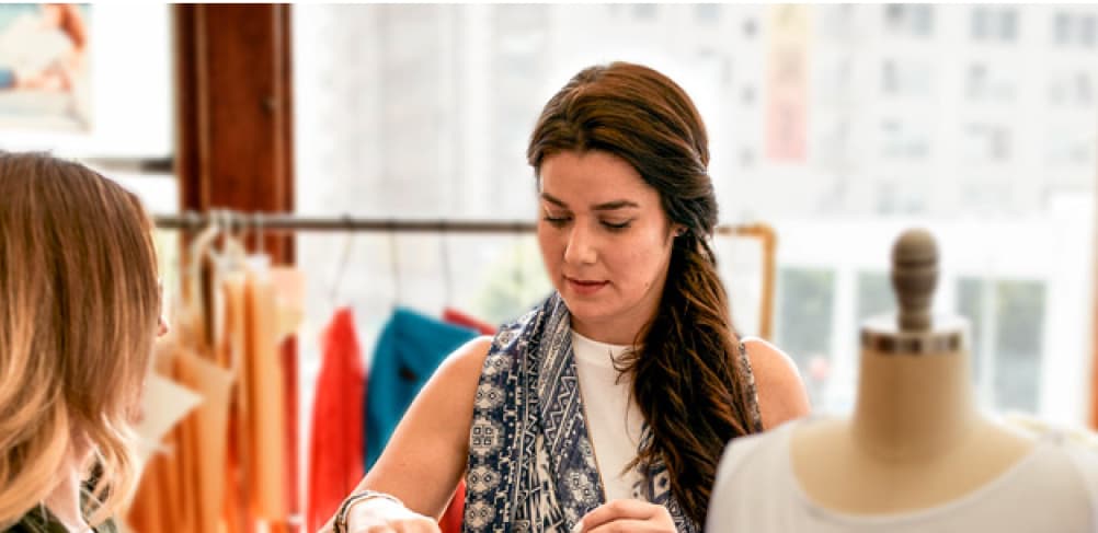 Business students collaborating together on a clothing project