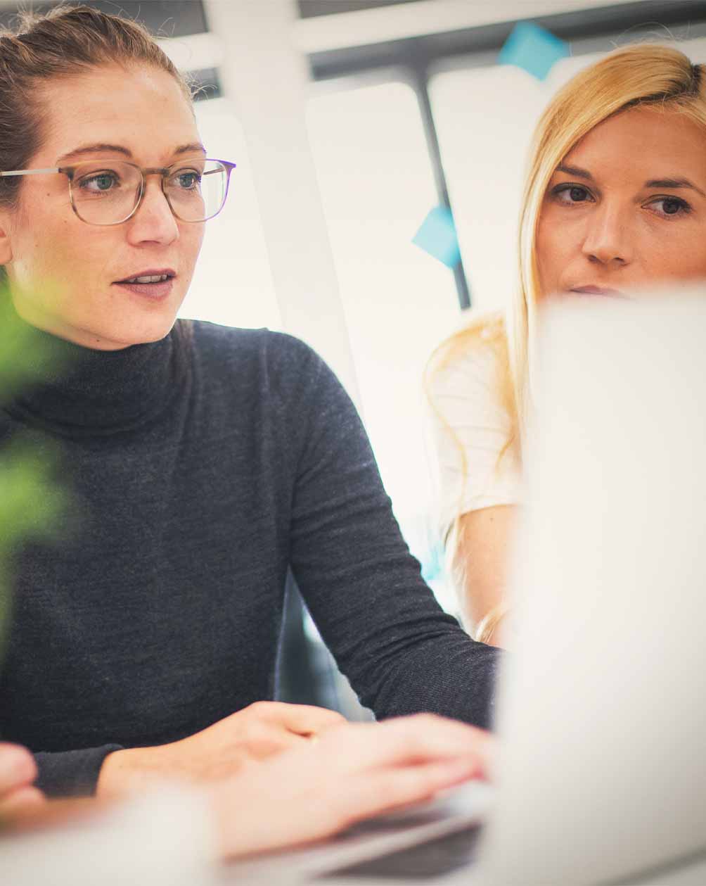 Women looking at a laptop working