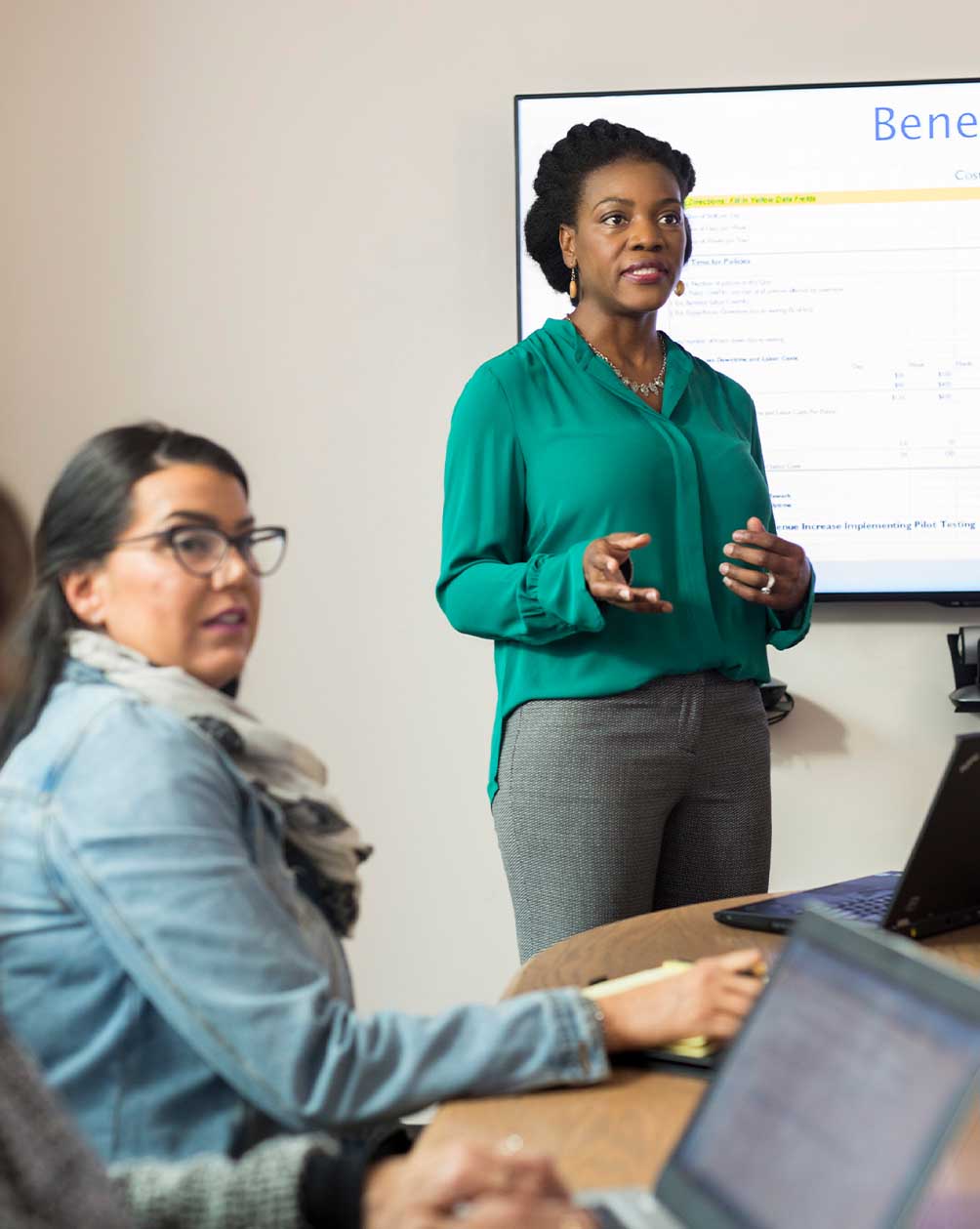 Woman presenting in a conference room