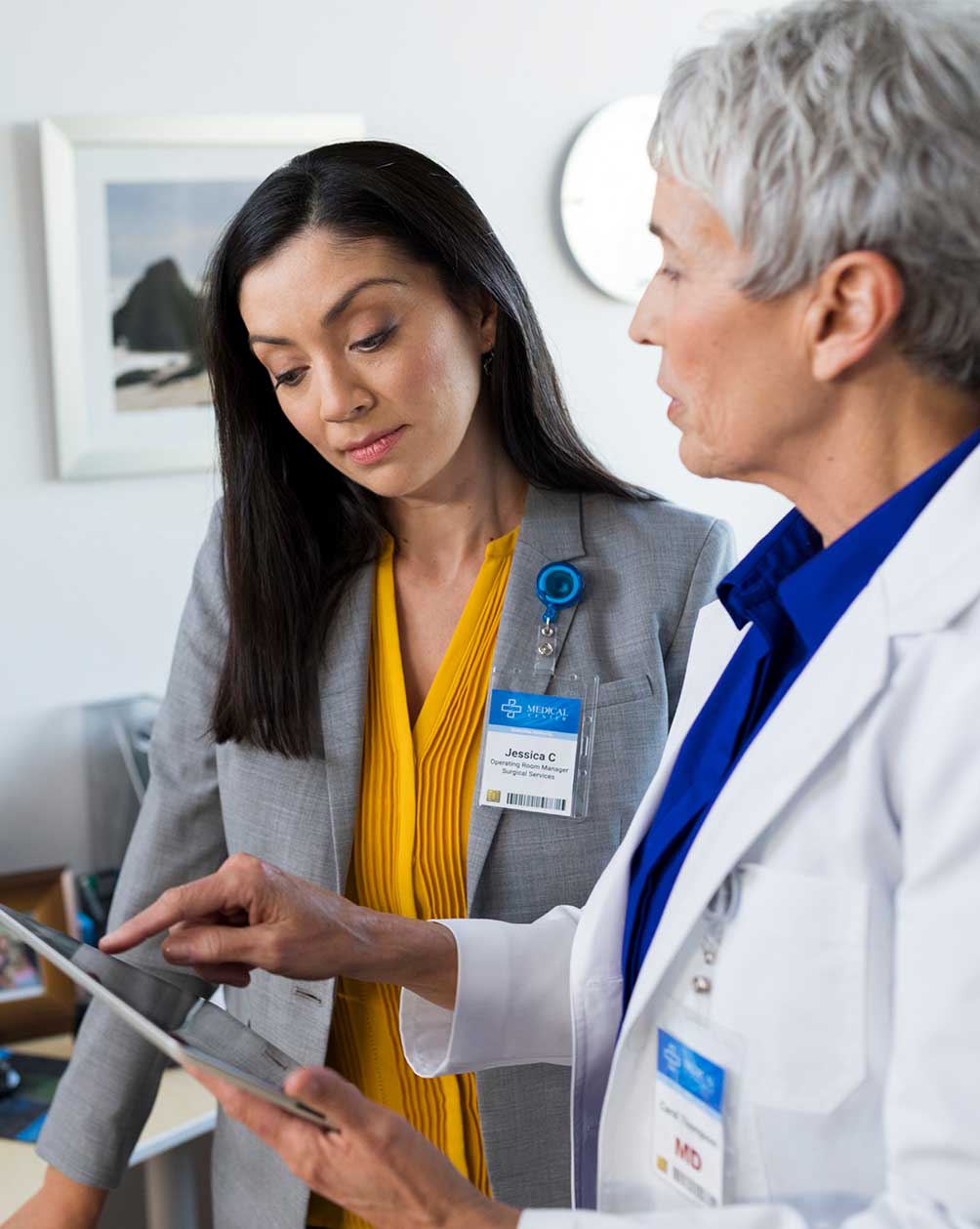 Health administrator and nurse going over paperwork