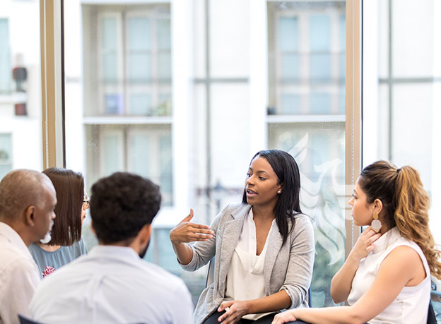 educator leading a small group discussion 