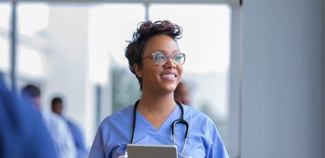 A nursing professional with a clipboard.