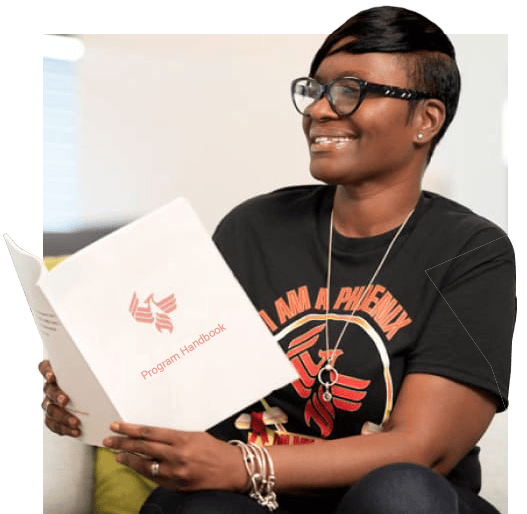 A new University of Phoenix student peruses a folder detailing admissions requirements