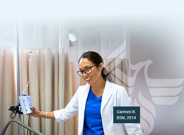 A woman in blue scrubs and a labcoat, puts the career-ready skills she gained from her rn to bsn degree to work in a hospital setting