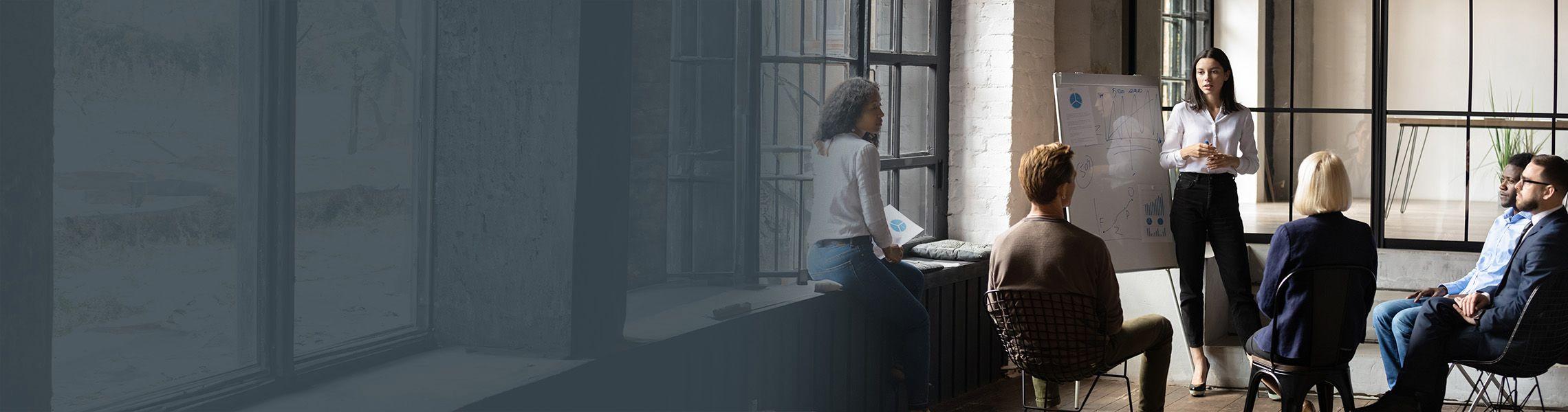 A confident corporate training coaching is giving a presentation.