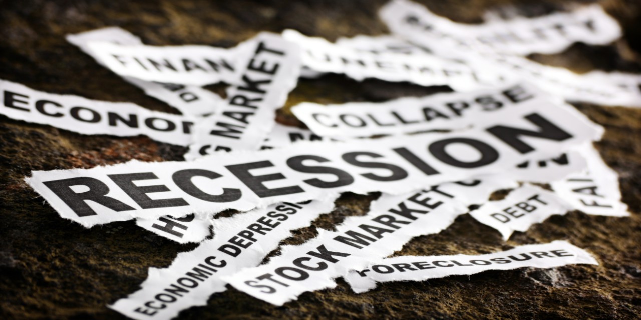 Newspaper cutouts featuring words like recession and stock market
