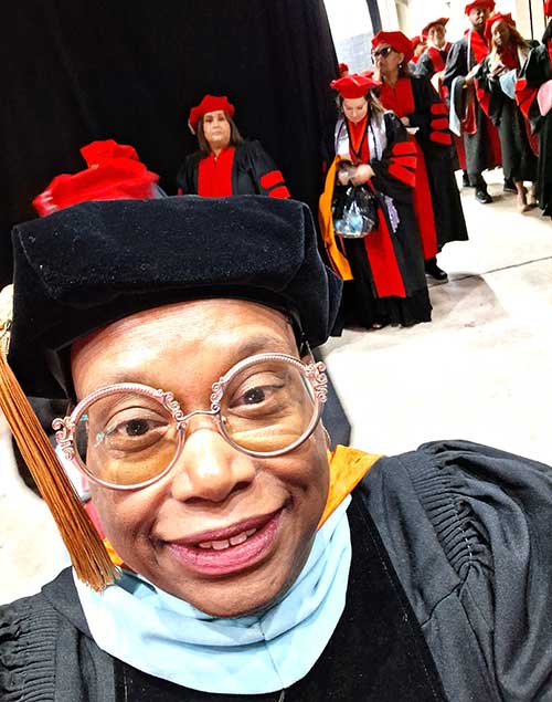 Dr. Stella Smith and group of graduates at UOPX commencement, San Antonio, July 2026 