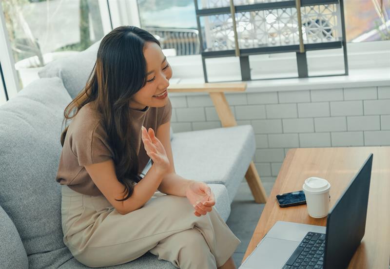 a university of phoenix student chatting with others online in the bravely belong cafe