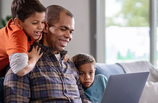 Stephen P. smiles as he shares an encouraging message from his Academic Advisor with his 2 sons