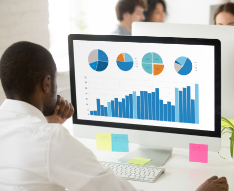 Man looking at data to understand employee capabilties