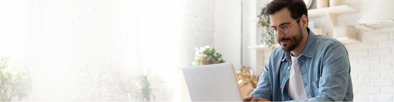 An adult working on their computer