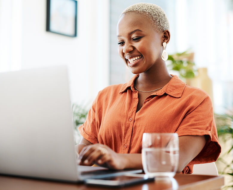 A woman signs up for upskill opportunities on her laptop.