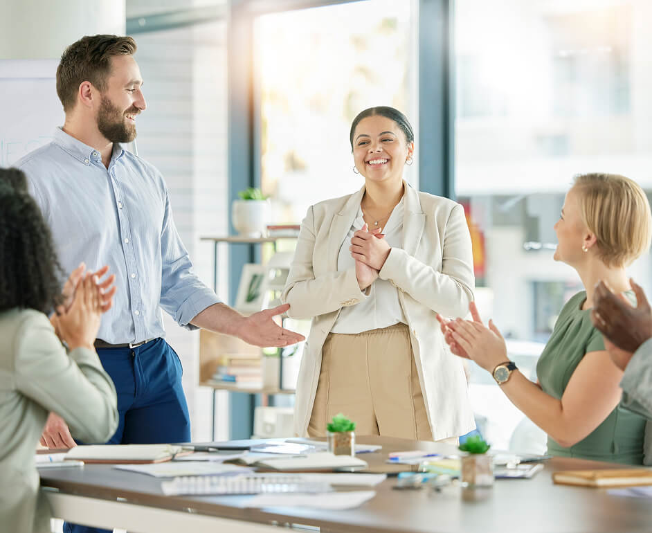 Group of employees working around a table