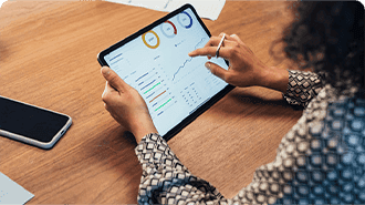 Person looking at google analytics on a tablet